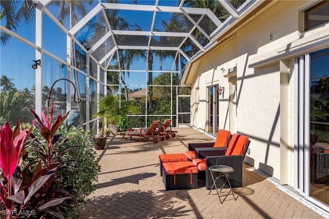 view of patio featuring a lanai