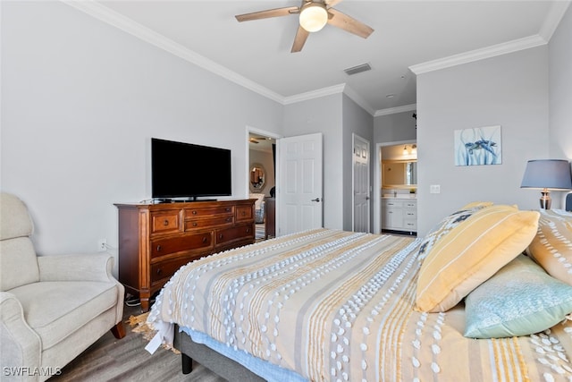 bedroom featuring ensuite bath, ceiling fan, crown molding, and wood-type flooring