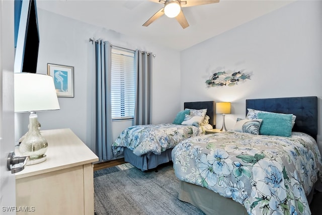 bedroom with hardwood / wood-style flooring and ceiling fan