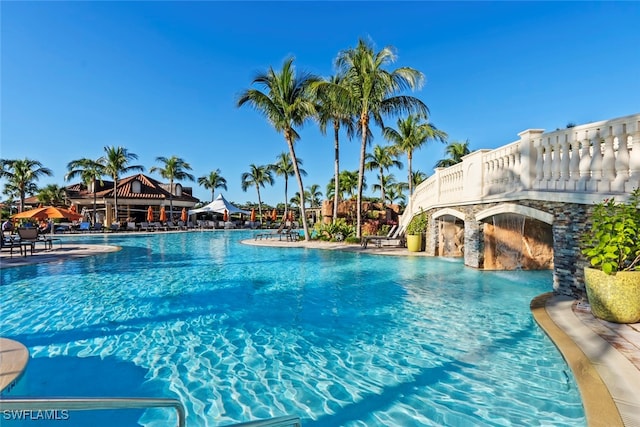 view of swimming pool featuring pool water feature