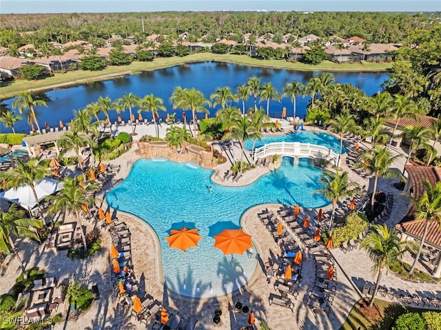 birds eye view of property with a water view