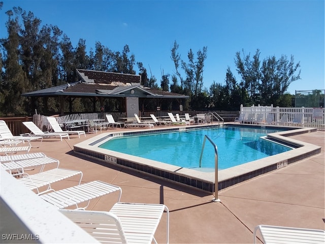 view of swimming pool with a patio