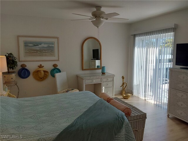 bedroom with access to exterior, light hardwood / wood-style flooring, and ceiling fan