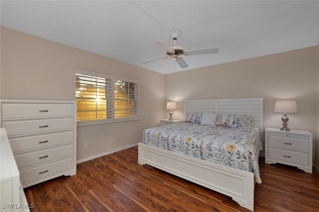 bedroom with dark hardwood / wood-style floors, a textured ceiling, and ceiling fan