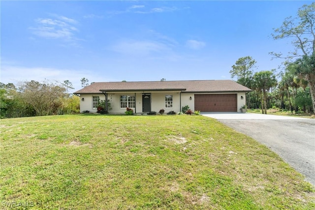 ranch-style home with a garage, a front yard, stucco siding, and aphalt driveway