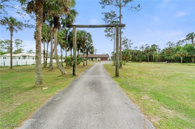 view of street with aphalt driveway