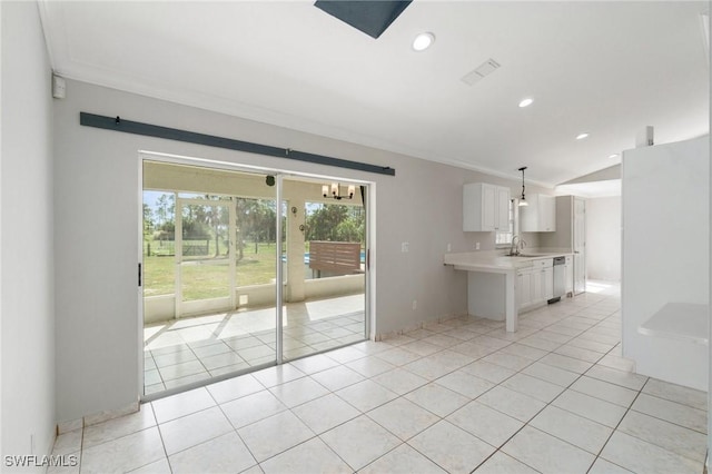 kitchen featuring light tile patterned floors, light countertops, white cabinetry, and recessed lighting