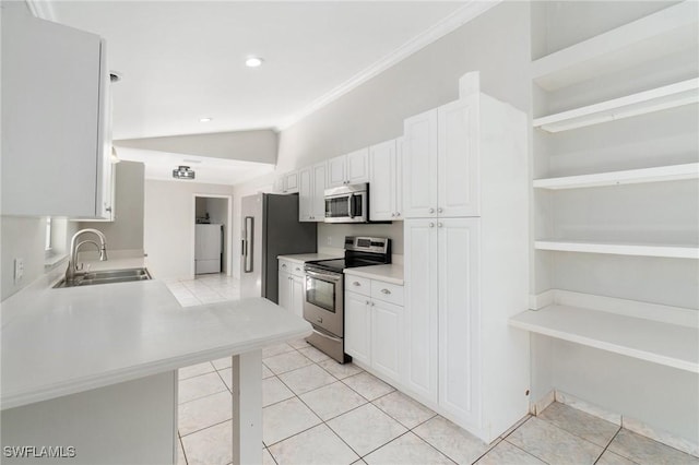 kitchen featuring white cabinetry, appliances with stainless steel finishes, light countertops, and a sink