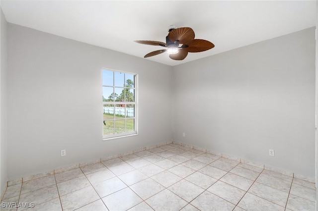 unfurnished room featuring light tile patterned floors and a ceiling fan