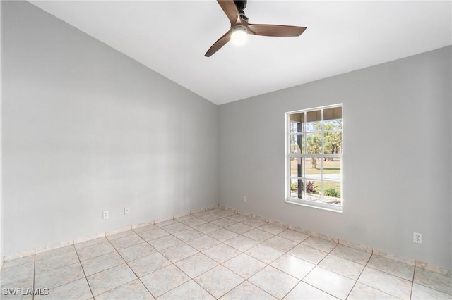 unfurnished room featuring ceiling fan, light tile patterned floors, and lofted ceiling