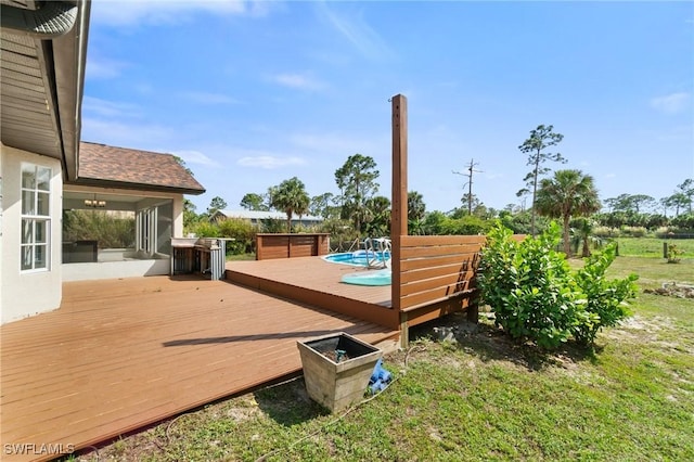 wooden terrace with an outdoor pool