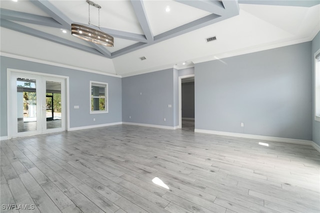 unfurnished room featuring beamed ceiling, light hardwood / wood-style flooring, french doors, and a chandelier