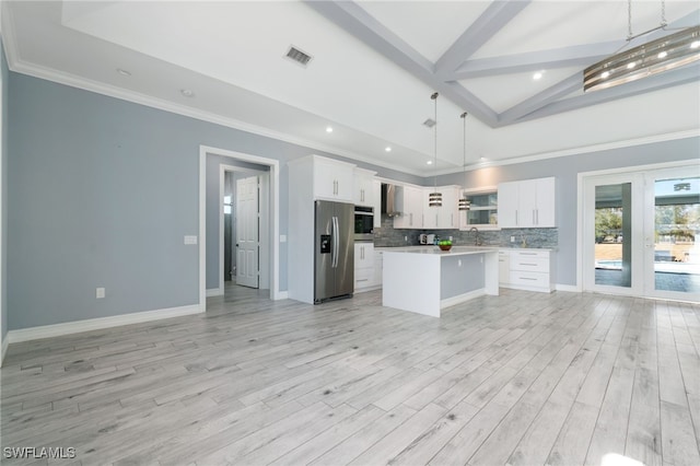 kitchen with a center island, hanging light fixtures, stainless steel fridge with ice dispenser, beam ceiling, and white cabinetry