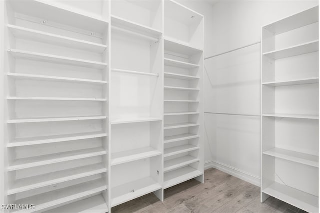 walk in closet featuring hardwood / wood-style floors