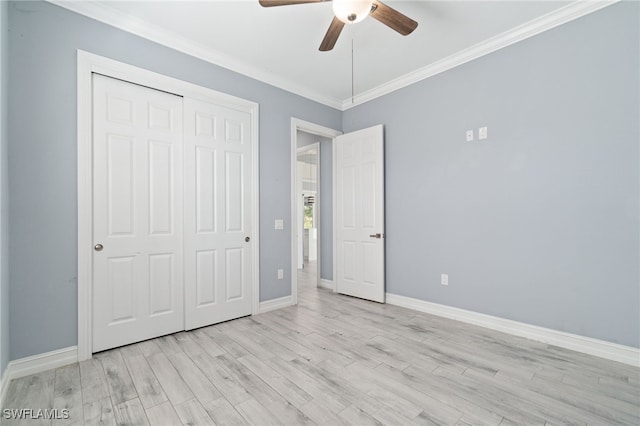 unfurnished bedroom featuring a closet, ceiling fan, crown molding, and light hardwood / wood-style flooring