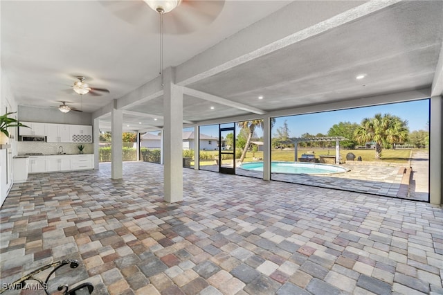 view of patio / terrace featuring sink and ceiling fan