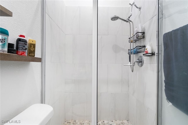 bathroom with a shower with shower door