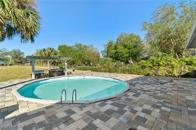 view of pool with a patio area and a pergola