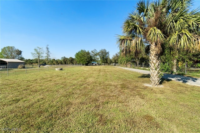 view of yard with a rural view