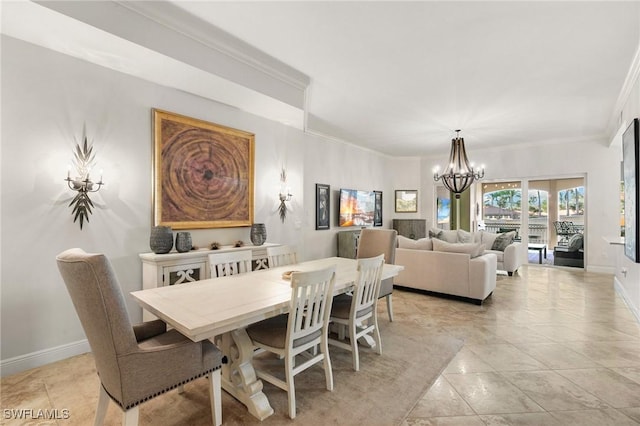 dining area featuring light tile patterned floors, an inviting chandelier, and crown molding