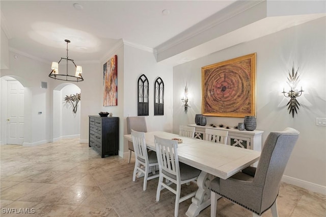 dining space with an inviting chandelier and crown molding