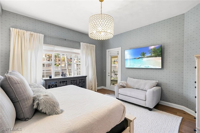 bedroom featuring hardwood / wood-style floors and lofted ceiling