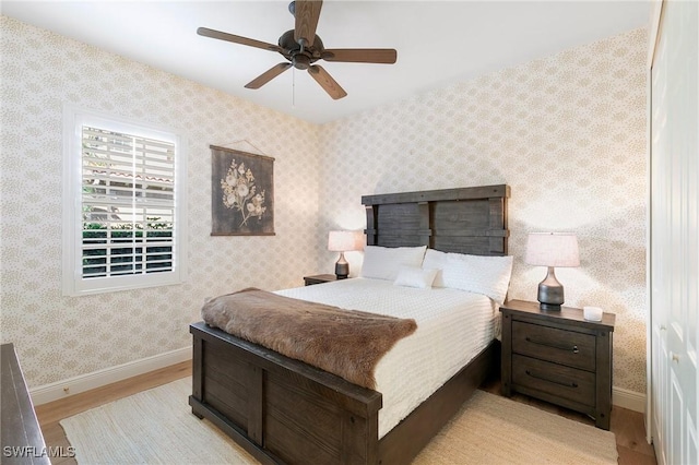 bedroom featuring ceiling fan and light hardwood / wood-style flooring