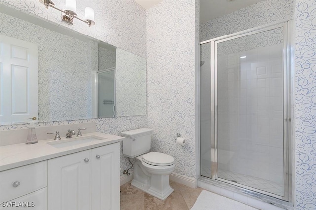 bathroom featuring tile patterned floors, vanity, toilet, and an enclosed shower