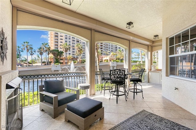 view of patio / terrace with outdoor lounge area and a water view