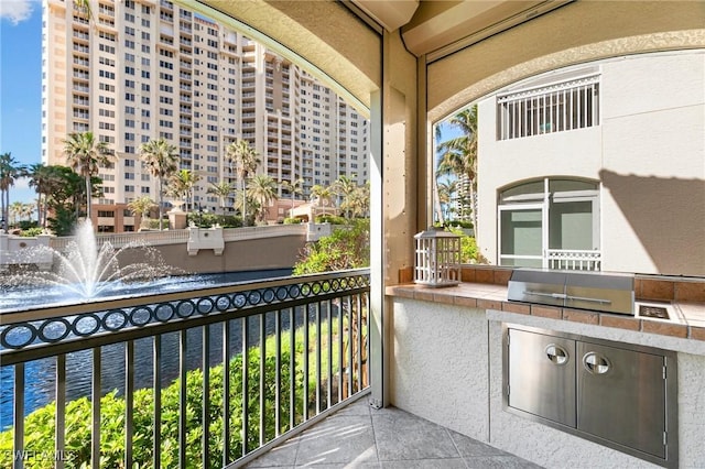 balcony with an outdoor kitchen