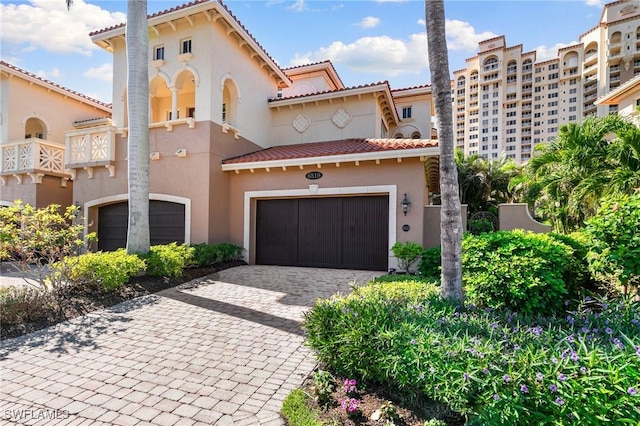 mediterranean / spanish house with a garage