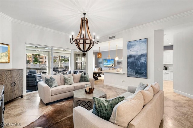 living room with ornamental molding and a chandelier