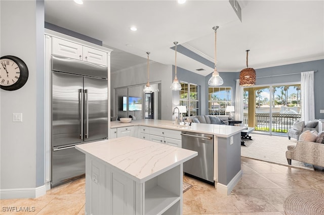 kitchen with sink, white cabinets, a healthy amount of sunlight, and appliances with stainless steel finishes