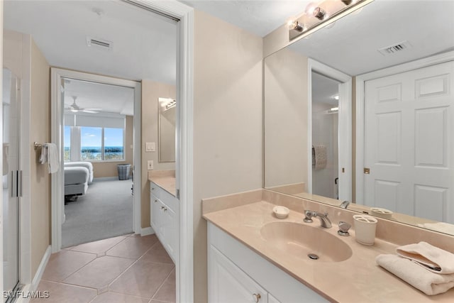 bathroom with tile patterned floors, ceiling fan, and vanity