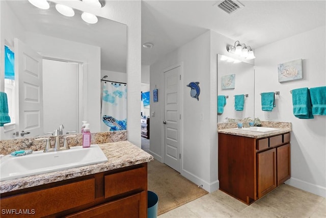 bathroom featuring tile patterned floors and vanity