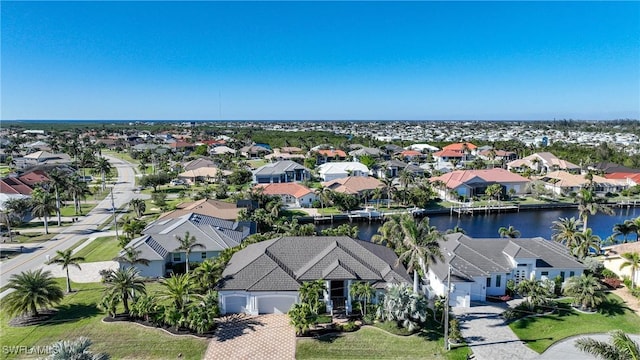 drone / aerial view with a water view