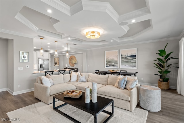 living room featuring crown molding and hardwood / wood-style flooring