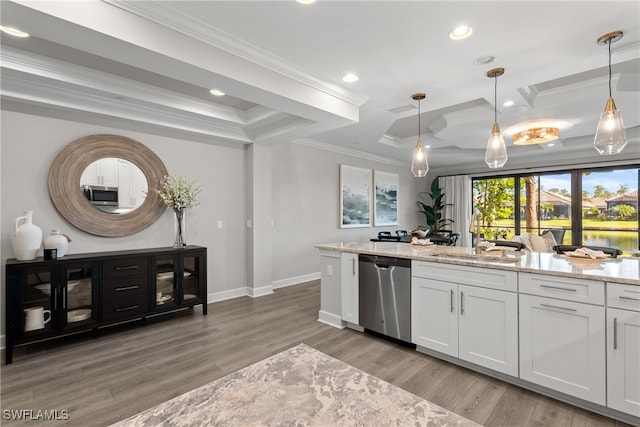 kitchen featuring pendant lighting, light hardwood / wood-style flooring, light stone countertops, appliances with stainless steel finishes, and white cabinetry