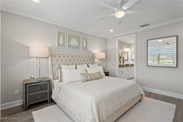 bedroom with ensuite bathroom, ceiling fan, dark hardwood / wood-style flooring, and crown molding