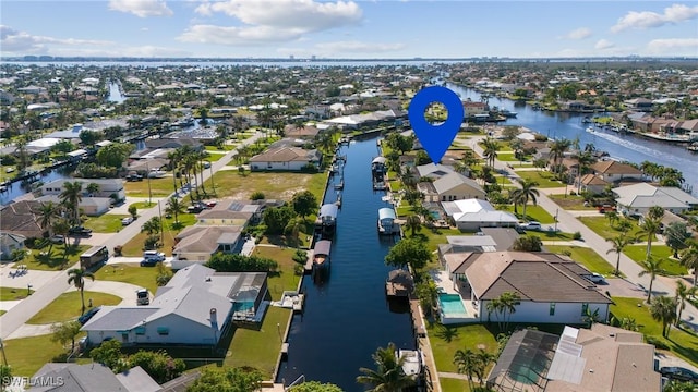 bird's eye view with a water view