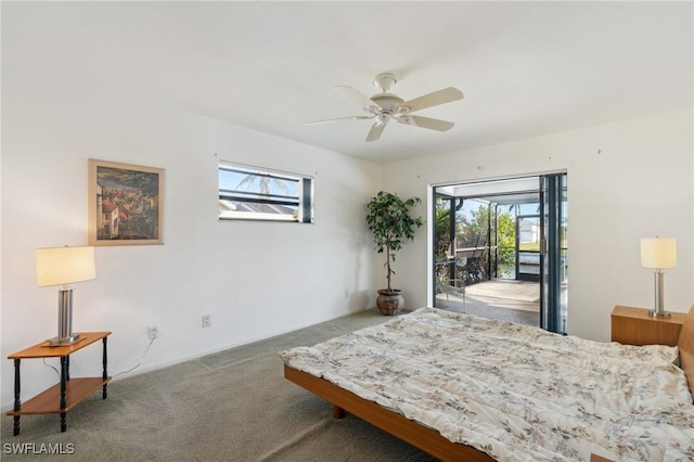 carpeted bedroom with access to outside, multiple windows, and ceiling fan