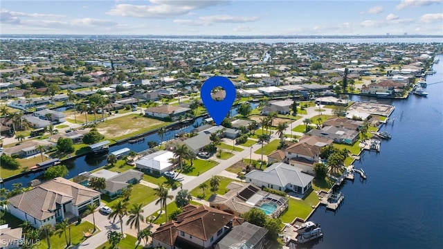 birds eye view of property with a water view