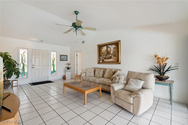 living room featuring light tile patterned floors, vaulted ceiling, and ceiling fan