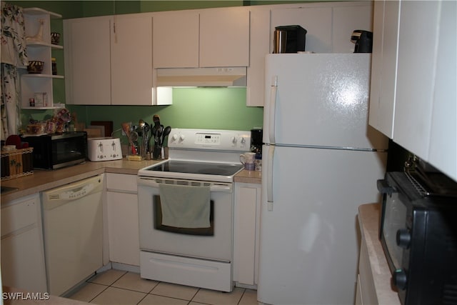 kitchen featuring white cabinets, light tile patterned floors, and white appliances