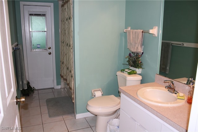 bathroom with tile patterned floors, vanity, and toilet