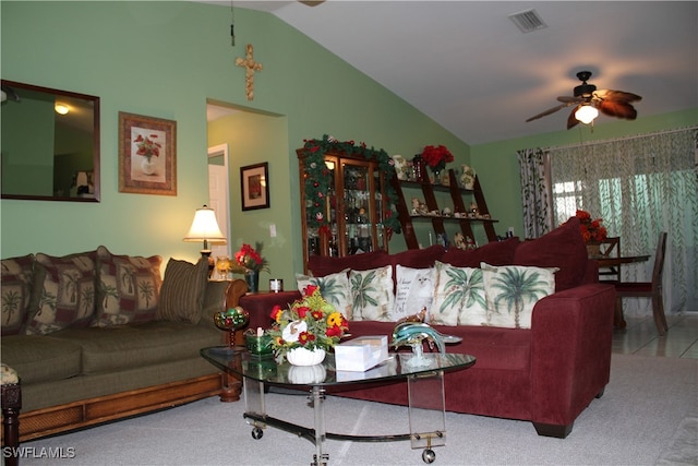 living room with carpet flooring, ceiling fan, and lofted ceiling