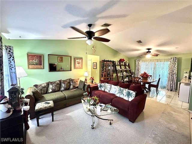 living room featuring lofted ceiling and light tile patterned floors