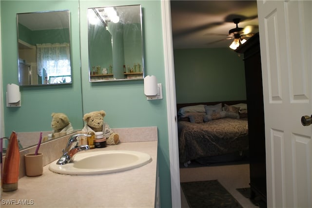 bathroom featuring ceiling fan and vanity