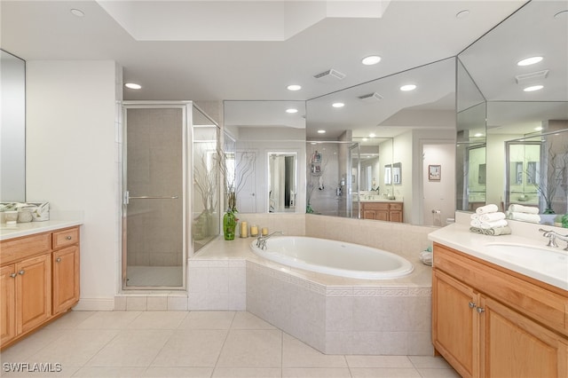 bathroom featuring tile patterned floors, vanity, and independent shower and bath