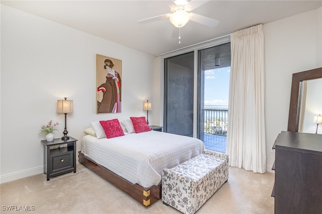 bedroom with light carpet, a wall of windows, access to outside, and ceiling fan